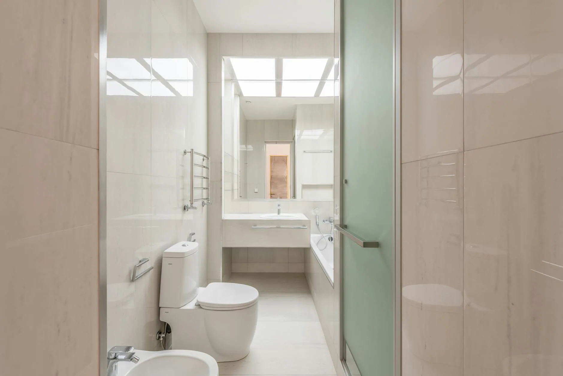 modern editorial bathroom idea: Comparison: Scandinavian Spa vs. Modern Glam with cream and warm neutrals with sage green and terracotta