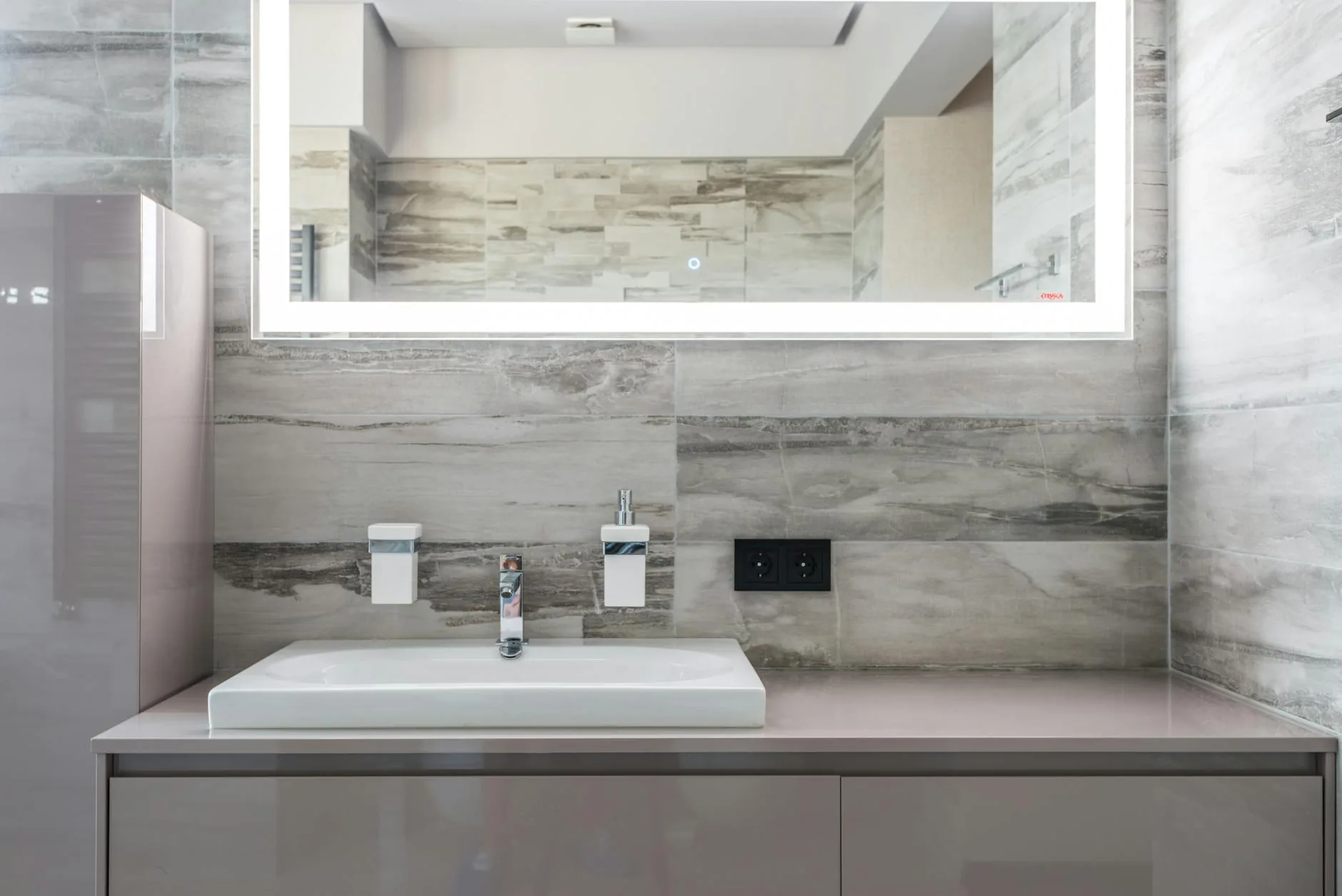 modern editorial bathroom idea: Monochromatic Minimalism with cream and warm neutrals with sage green and terracotta accents, designer-curated bathroom decor