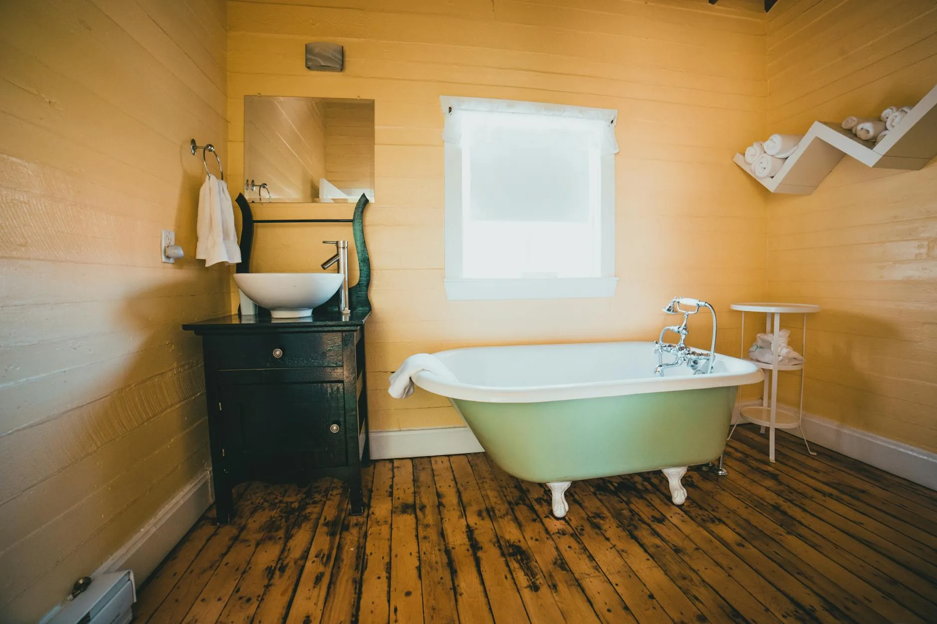 modern editorial bathroom idea: Retro Revival with cream and warm neutrals with sage green and terracotta accents, designer-curated bathroom decor