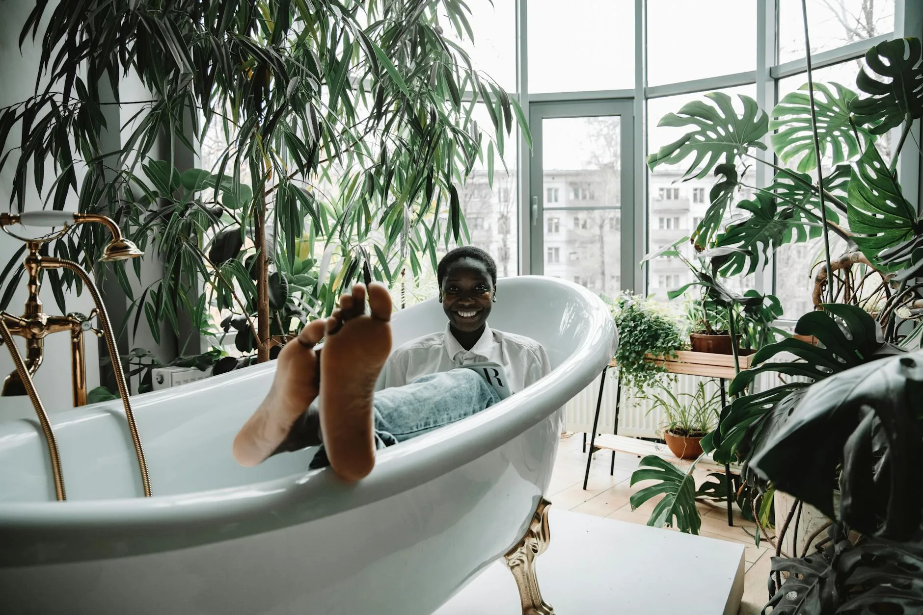modern editorial bathroom idea: Urban Jungle with cream and warm neutrals with sage green and terracotta accents, designer-curated bathroom decor