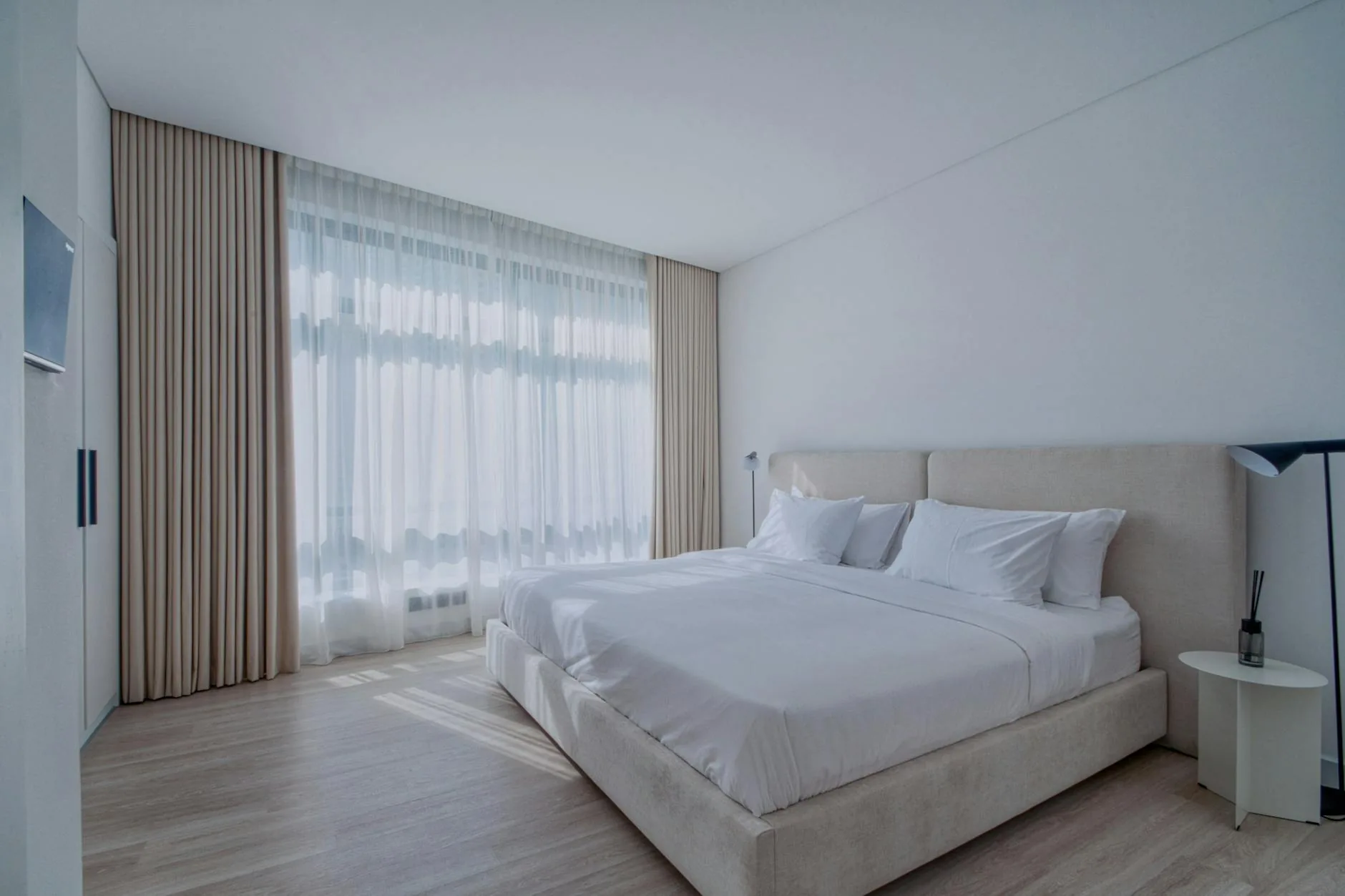 modern editorial bedroom idea: Natural Light Maximization with cream and warm neutrals with sage green and terracotta accents, designer-curated modern