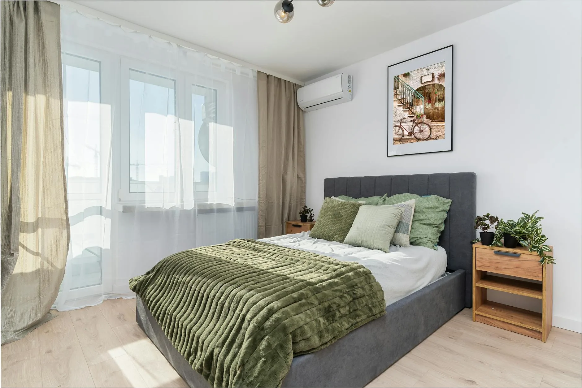 modern editorial bedroom idea: Textured Layering with cream and warm neutrals with sage green and terracotta accents, designer-curated modern bedroom
