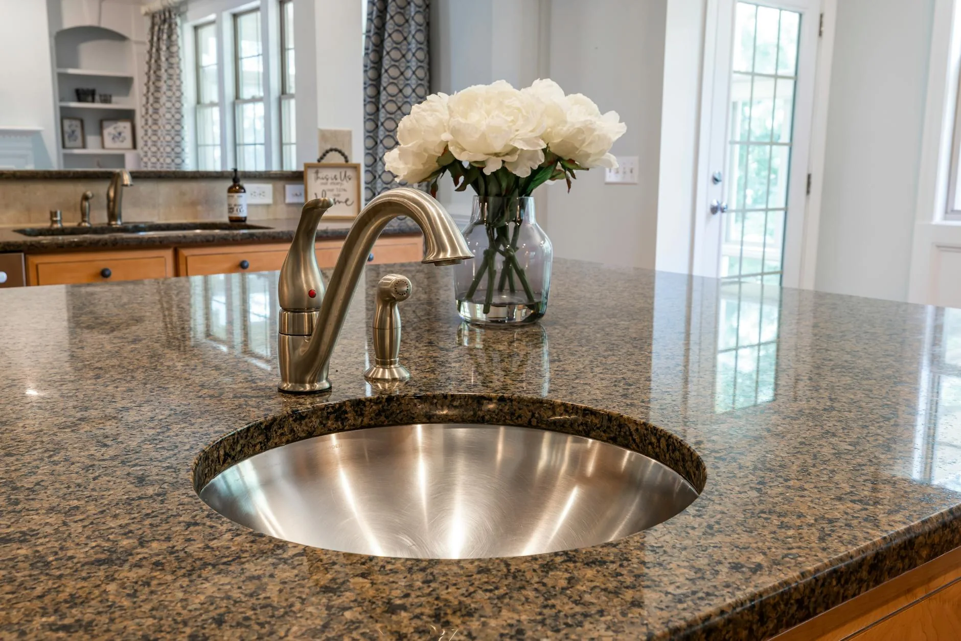 modern editorial kitchen idea: Comparison: Quartz vs. Granite Countertops with cream and warm neutrals with sage green and terracotta accents,