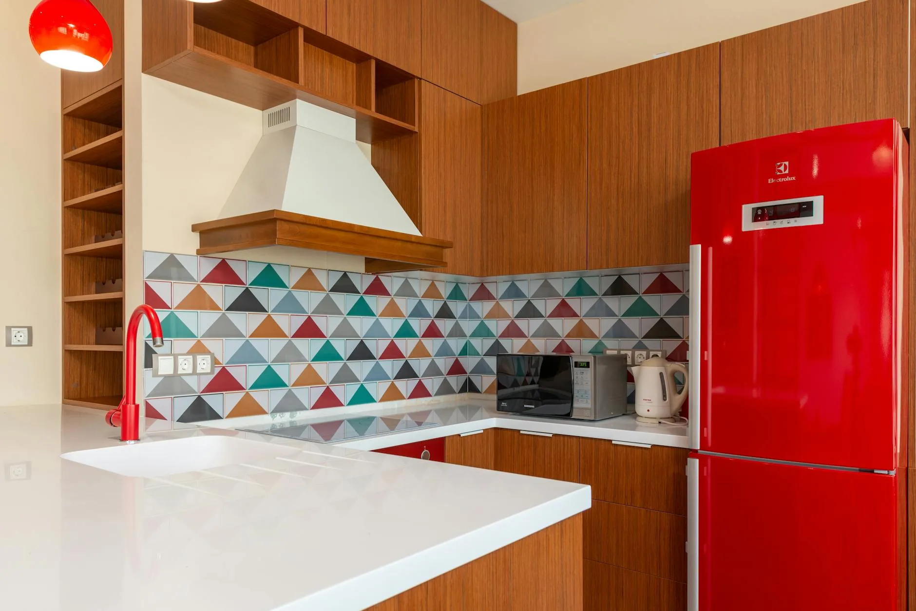 modern editorial kitchen idea: Geometric Backsplashes with cream and warm neutrals with sage green and terracotta accents, designer-curated modern kitchen