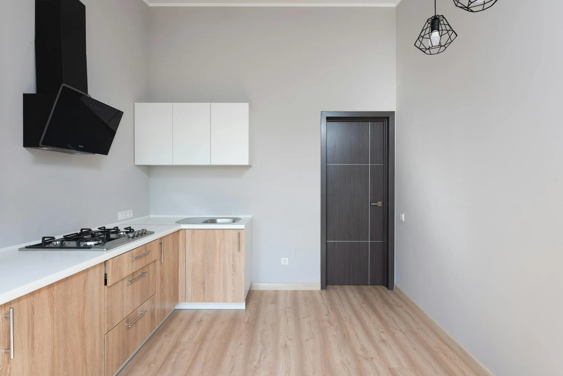 modern editorial kitchen idea: Minimalist Matte Finishes with cream and warm neutrals with sage green and terracotta accents, designer-curated modern