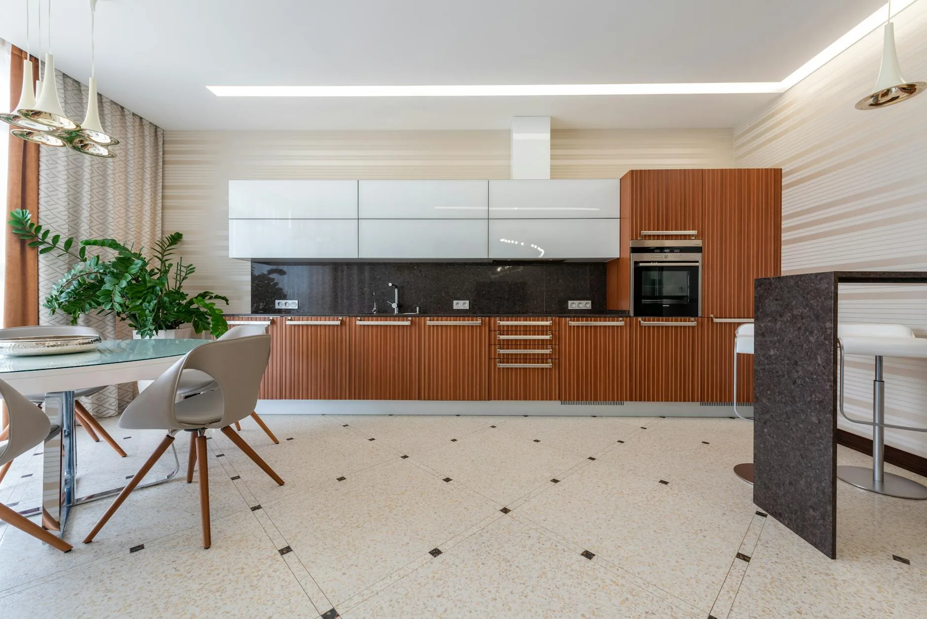 modern editorial kitchen idea: Natural Stone Flooring with cream and warm neutrals with sage green and terracotta accents, designer-curated modern