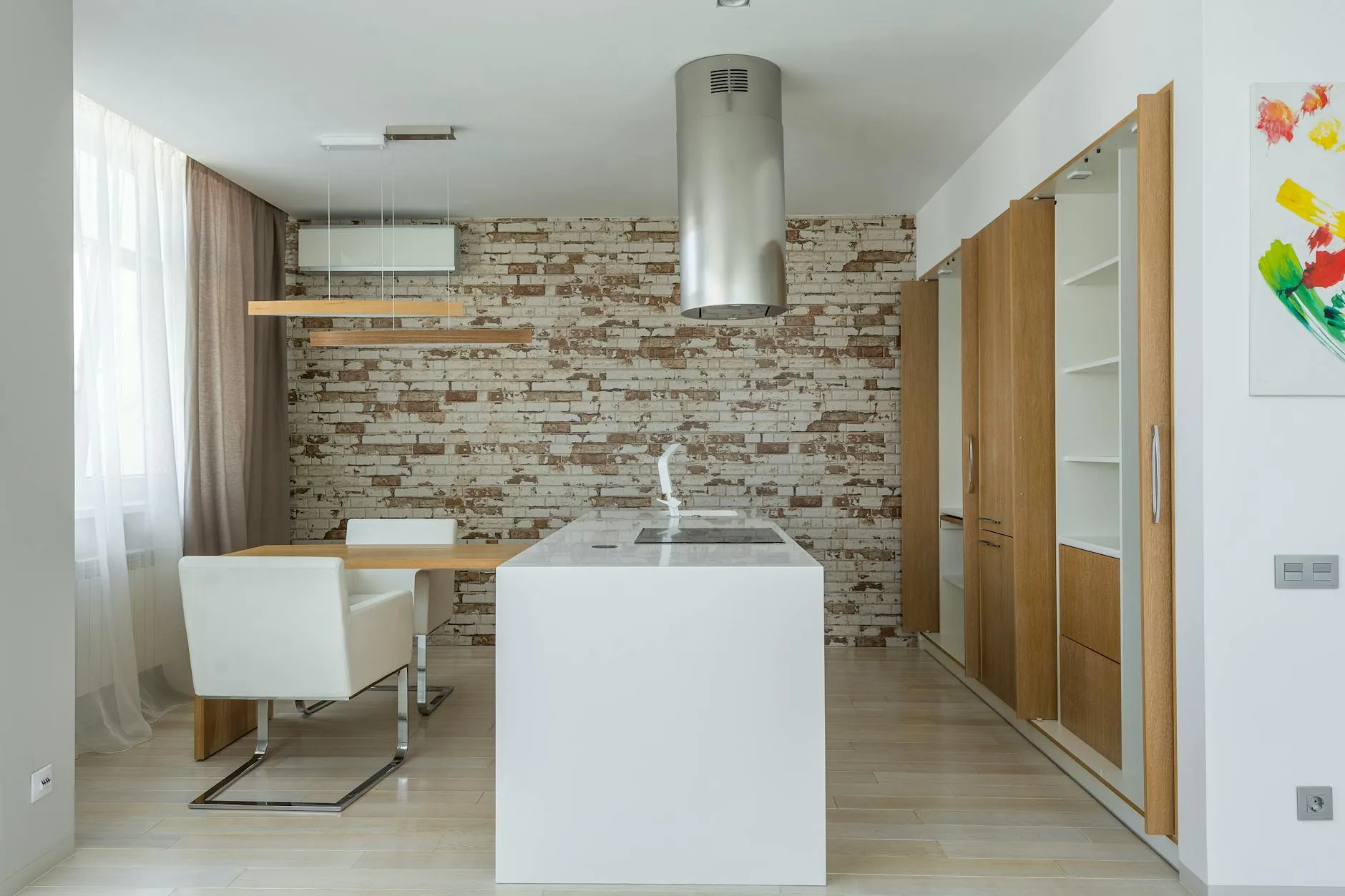 modern editorial kitchen idea: Statement Range Hoods with cream and warm neutrals with sage green and terracotta accents, designer-curated modern
