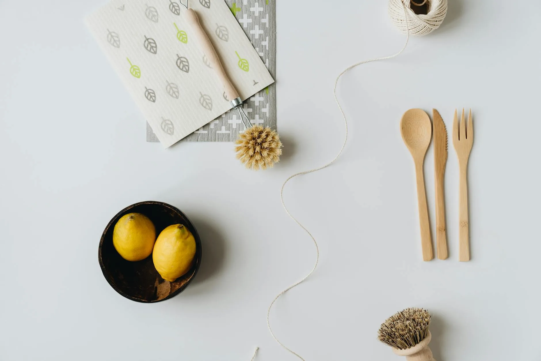 modern editorial kitchen idea: Sustainable Materials with cream and warm neutrals with sage green and terracotta accents, designer-curated modern kitchen
