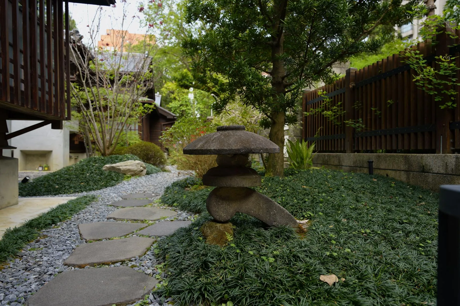 modern editorial outdoor space idea: Natural Stone Paths with cream and warm neutrals with sage green and terracotta accents, designer-curated