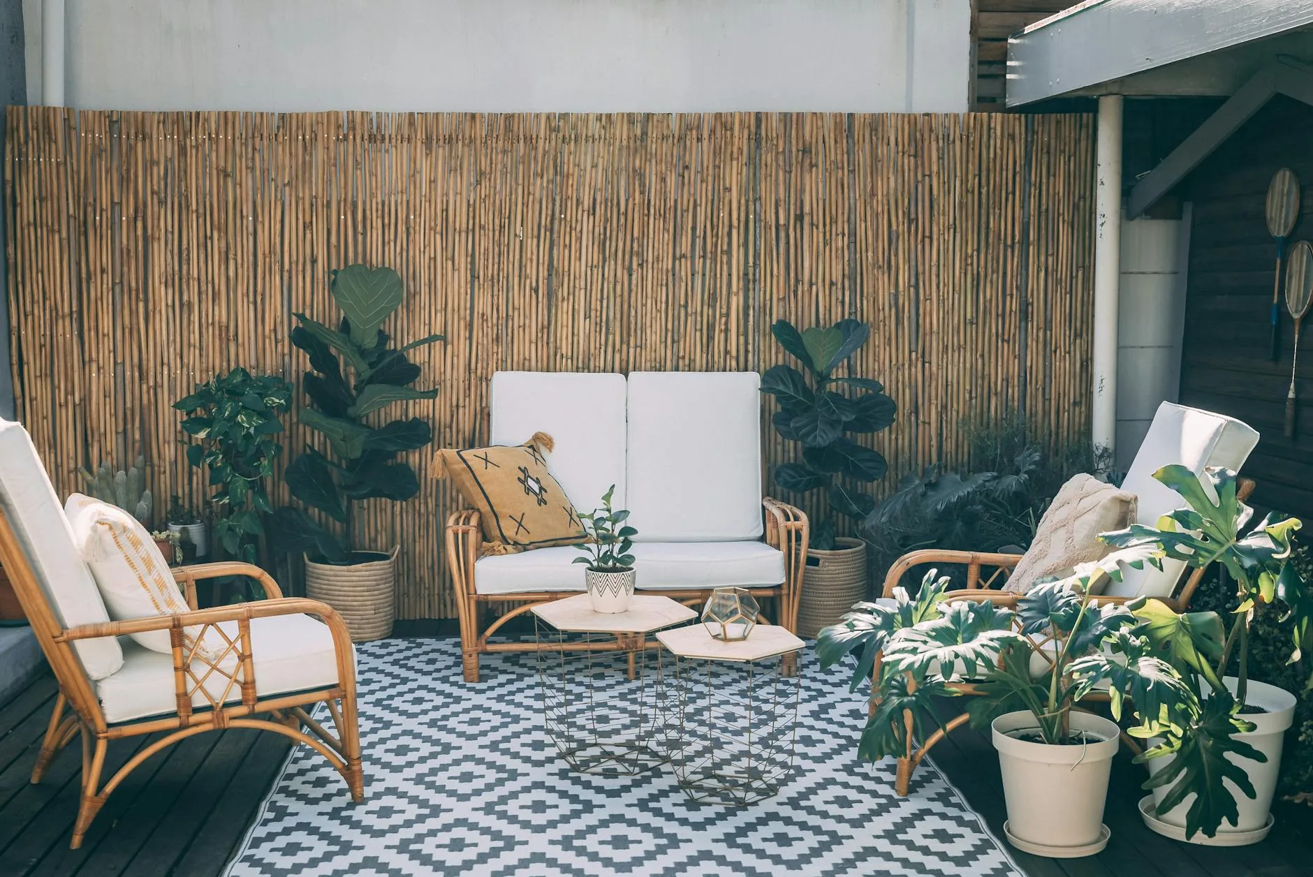 modern editorial outdoor space idea: Outdoor Rugs: Pattern vs. Solid with cream and warm neutrals with sage green and terracotta